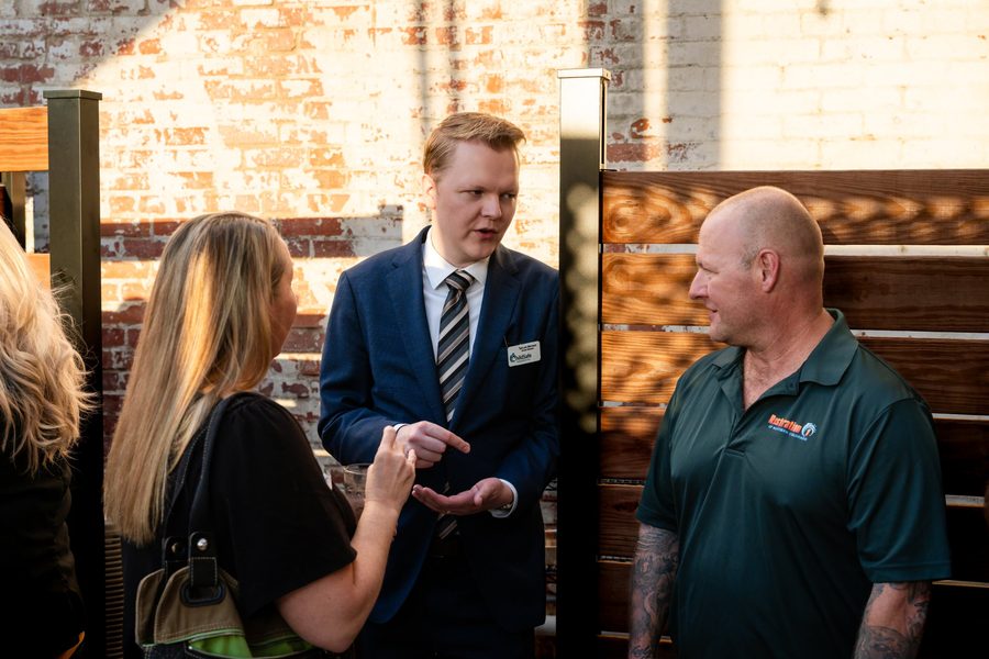 Two attendees in conversation at a SURE Networking mixer