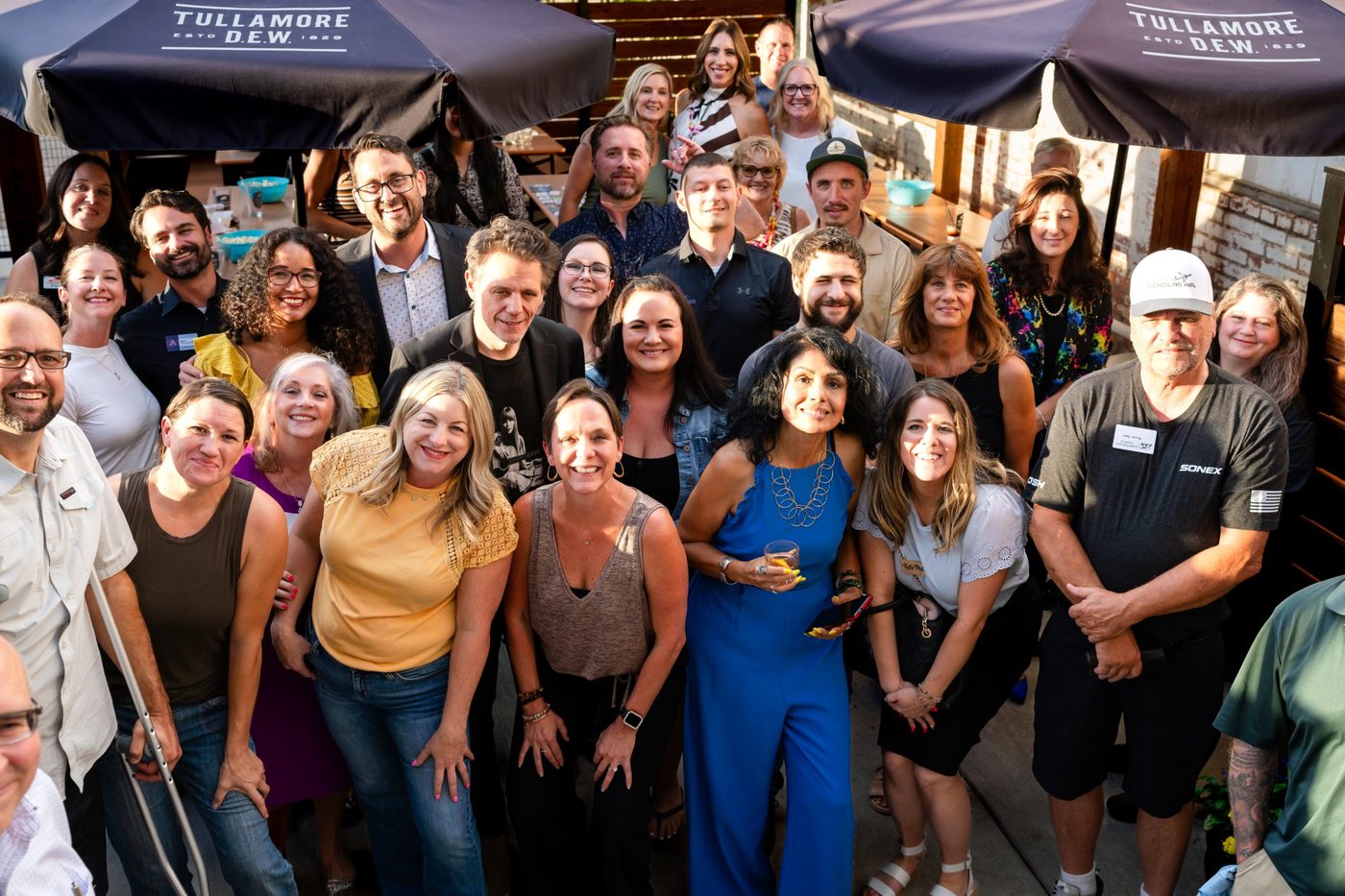 SURE Networking members gathered for a group photo on a patio